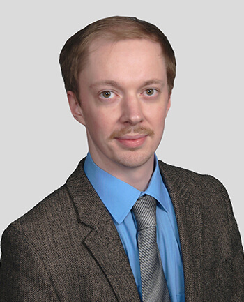 Headshot of Joshua Karoly