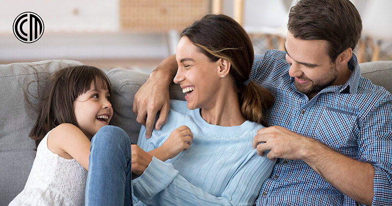 A family laughing and not worrying thanks to the equity they found in their home