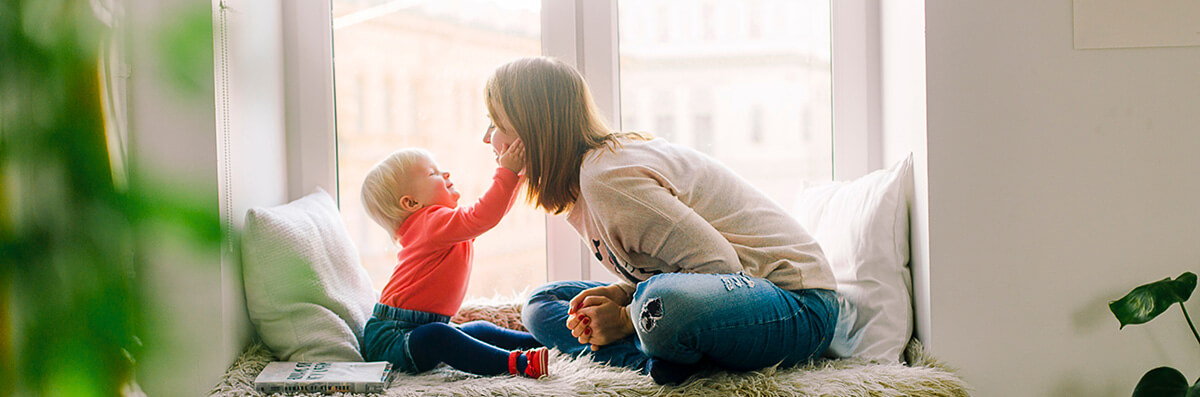 A veteran playing with her child